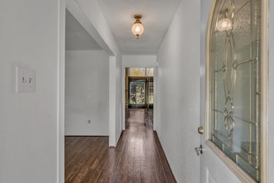 Enter your new home, with the dining room to the left, the living room straight ahead and 2 bedrooms and a full bath to the right.