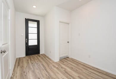 Light, wood like flooring flows through out the home.