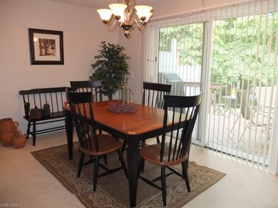 Dining room with slider to tiered deck.