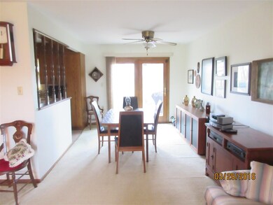 Dining area open to living room and kitchen