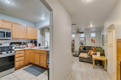 Kitchen with appliances with stainless steel finis