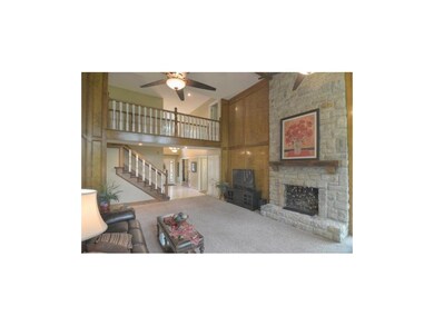 2 Story Great Room with Stone Fireplace & Cat Walk