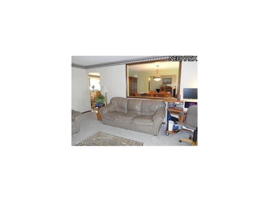 View of dining room through framed wall opening