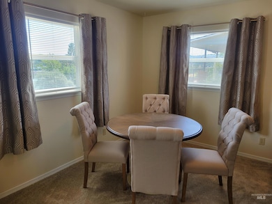 Dining area with carpet floors
