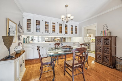 Dining area with custom glass cabinets/drawers/sto