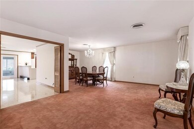The living area, dining area and den are all amply