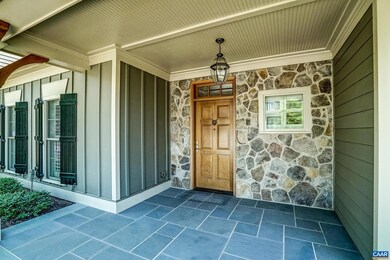 Bluestone zero step front porch with stone accent 