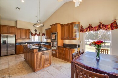 Gourmet kitchen with Alderwood custom cabinets, st