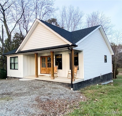 View of front of home featuring a shingled roof, a