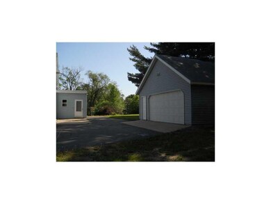 Facade/Exterior Front. Oversized Two car garage su