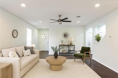 Living area featuring recessed lighting, wood finished floors, and a ceiling fan