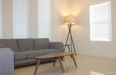 Living area featuring baseboards
