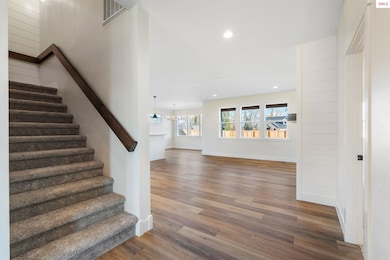 Stairs lead to 2 large bedrooms and bath