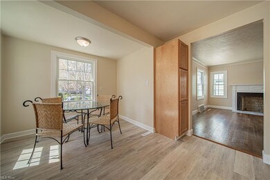 Eat-in kitchen with a peek of the living room fire