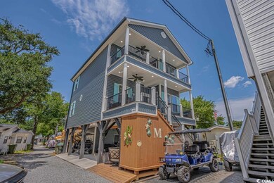 View of front facade with a balcony and ceiling fa