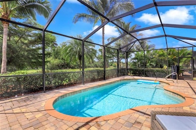 Swimming pool featuring a patio area and glass enclosure