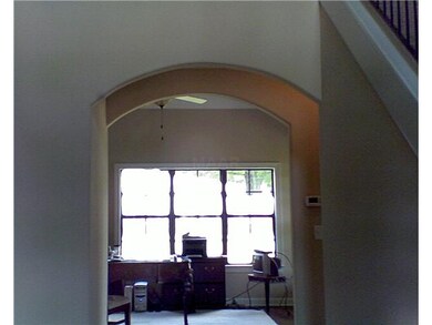 FROM FOYER ARCHWAYS LEAD INTO GREAT ROOM