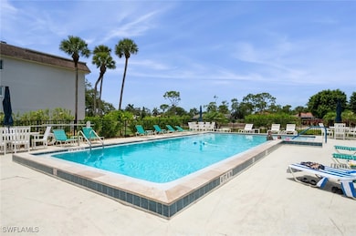 Community pool featuring a patio area