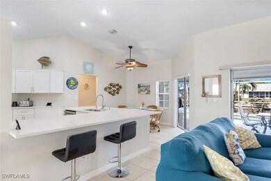 Kitchen featuring light tile patterned floors, vis
