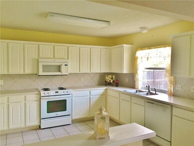 LARGE OPEN KITCHEN WITH CERAMIC TILE BACK SPLASH