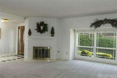 Spacious living room with gas fireplace and bay wi