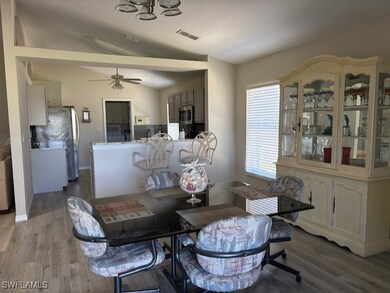 Dining space featuring a ceiling fan, visible vent