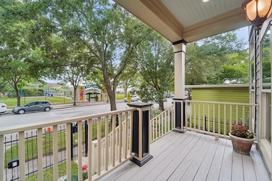 Step up to the charming front porch overlooking the tree lined street.