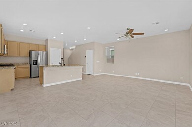 Unfurnished living room with recessed lighting, light tile patterned floors, and ceiling fan