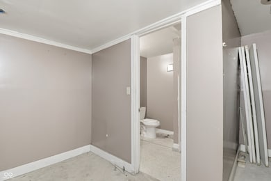 bathroom with toilet and baseboards