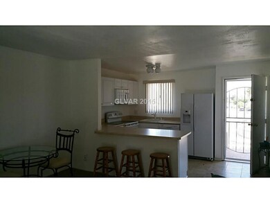 Property Photo. Kitchen has breakfast bar and is n