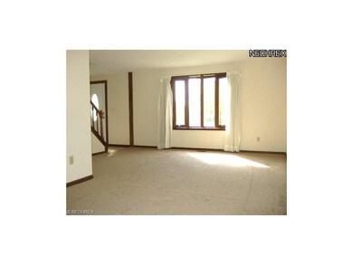 The spacious living room leads to the formal dinin