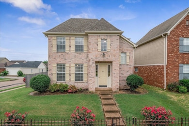 View of front of home featuring brick siding