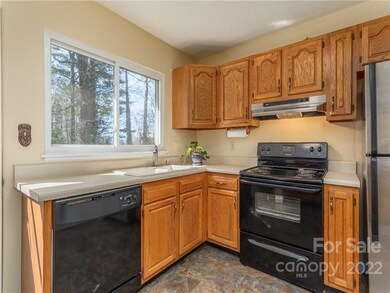 Large Kitchen with lots of light and back deck doors