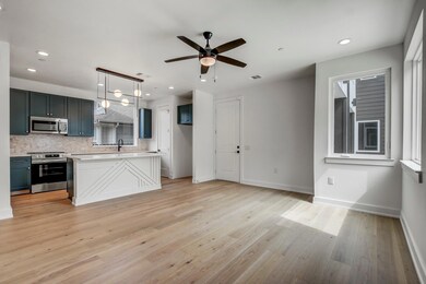 Kitchen with stainless steel appliances, light co