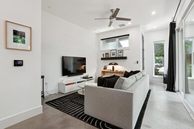Living room featuring concrete flooring, ceiling 