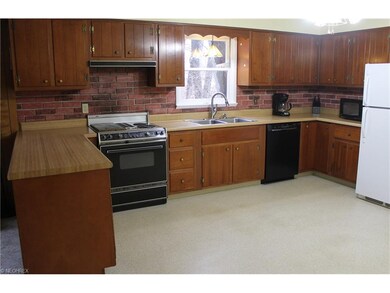 Kitchen is sparkling clean and cabinets well-cared