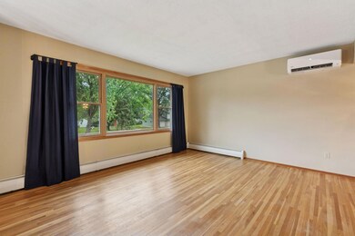Bright living room with a new ductless air conditioner.