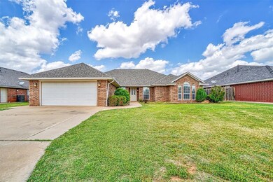 Ranch-style house with a garage, central air condi