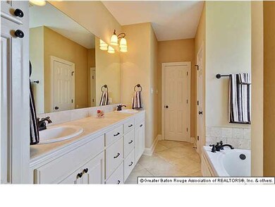 Spacious master bath with large tub and separate s