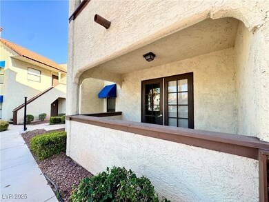 Doorway to property with stucco siding