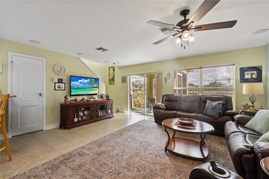 Living room featuring light tile patterned floorin