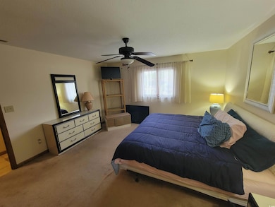 Bedroom featuring carpet floors and ceiling fan