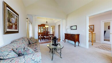 The living room is open to the formal dining room.