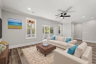 Living room with ceiling fan, wood-type flooring, 
