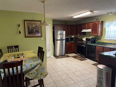 Kitchen featuring black appliances, under cabinet 