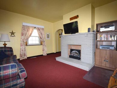Living Room. Attractive fireplace, not presently l