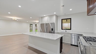 Kitchen featuring sink, light hardwood / wood-styl