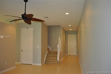 Foyer leads into the living area which has tile fl