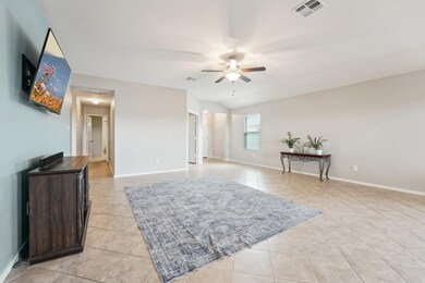 Living room featuring light tile patterned floors