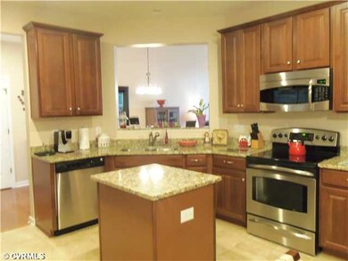 Kitchen - Kitchen with granite countertops, island